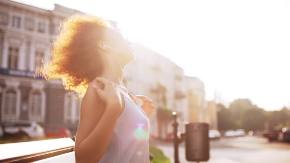 Beautiful Redhead Girl Enjoying Relaxing Sitting on Bench Outside Slow Motion alt