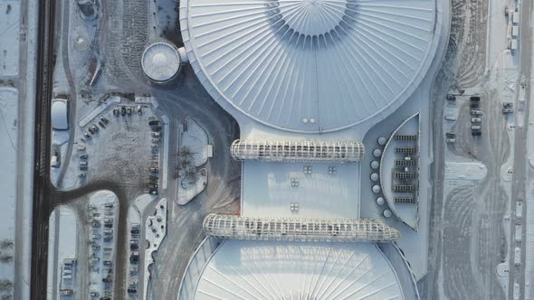 Top view in winter of a modern sports complex with parking in Minsk. Belarus alt