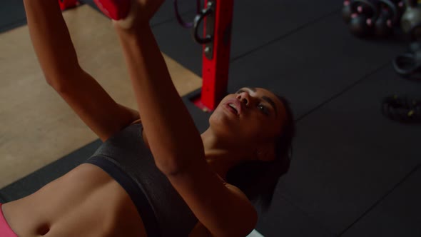 Lovely Motivated Sporty Fitness Black Female Exercising Dumbbell Bench Press alt