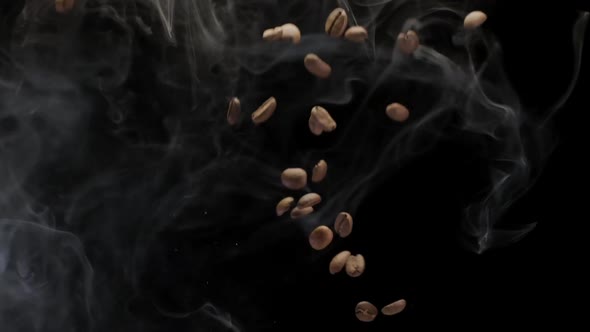 A Coffee Beans Falling in Slow Motion on Black Background With Smoke