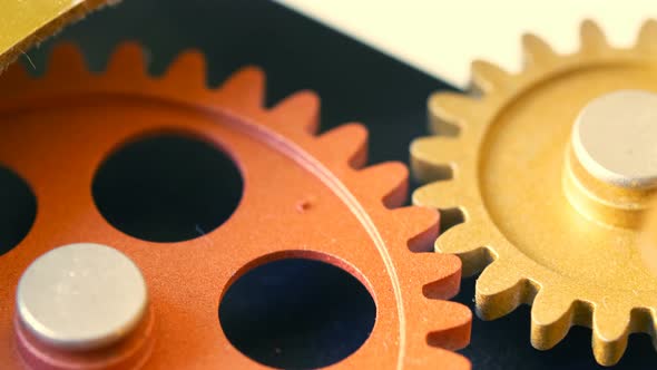 clock wheels turning,touching each other: idea, progress,evolution- close up alt