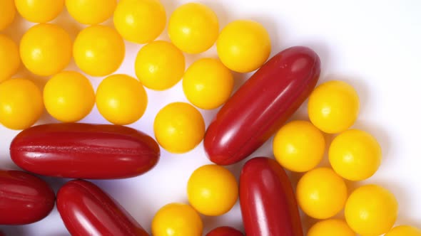 pills close-up. round yellow and red capsule pills close up