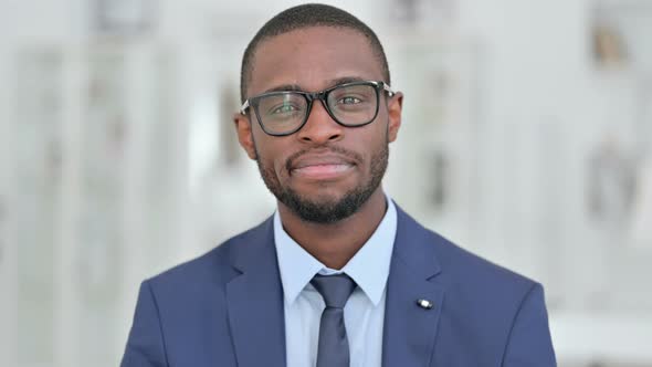 Portrait of Cheerful African Businessman Doing Video Call  alt