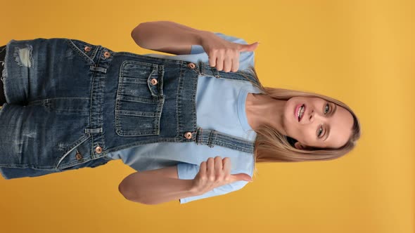 VERTICAL VIDEO POV Successful Woman Showing Thumbs Up Celebrating Win Gesture Posing Isolated alt