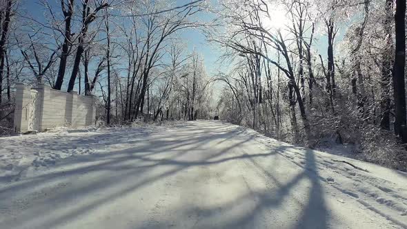 Point of View From Drives Side Vehicle Driving on a Road After a Freezing Rain alt