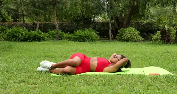 Active fitness young woman working out abdominals. alt