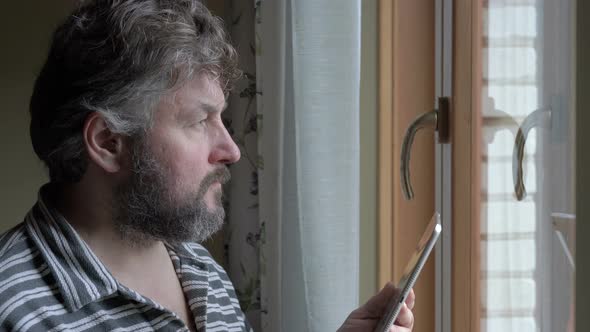 male businessman drinking coffee and working on a tablet