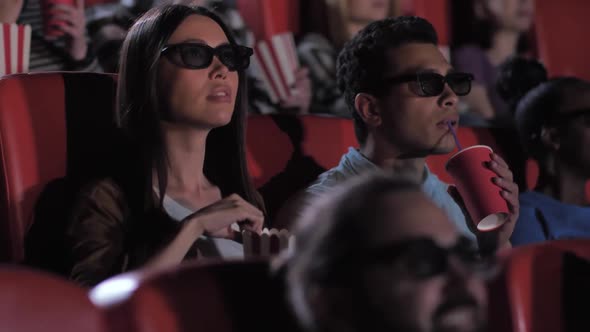 Mixed Race Couple Enjoying 3d Movie in Cinema alt