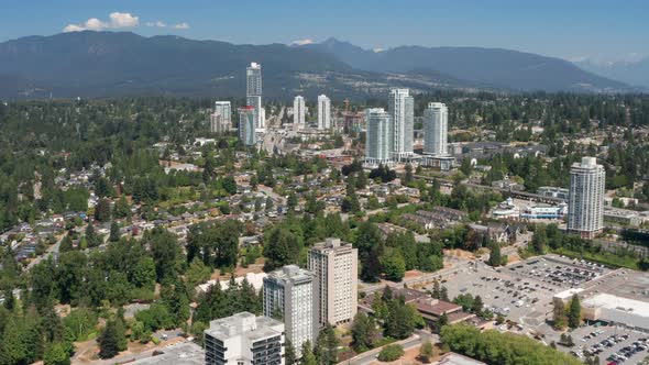 Burquitlam Transit Station And High-rise Apartment Complex In Coquitlam, BC, Canada. - aerial, wide alt