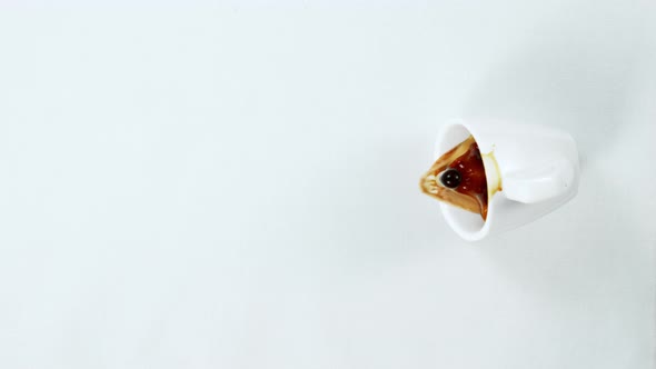 Super Slow Motion Shot of Spilling Coffee on White Cloth at 1000Fps. alt