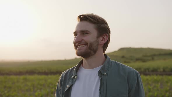 Close Up View of a Young Farmer on a Corn Field alt