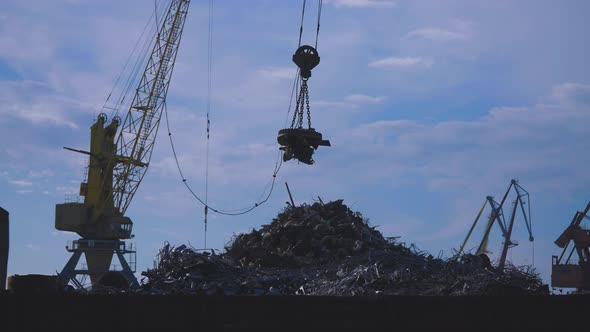 Giant Cranes at the Scrap Metal Collection Point alt