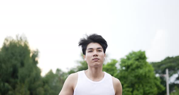 Fit asian man running alt