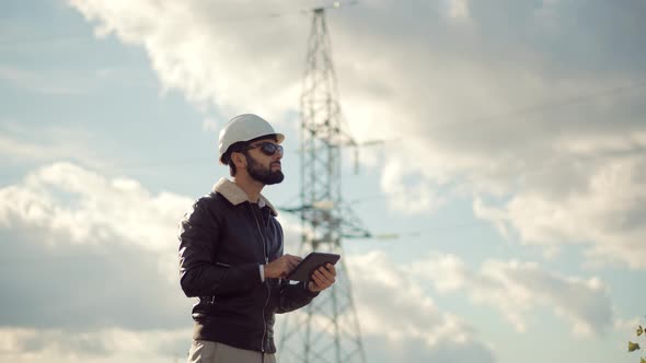 Electrical Engineer In Hard Hat.Foreman Developer Checking Construction.Architect In Hardhat Helmet alt