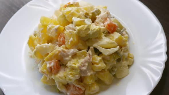 Russian Potato Salad on a White Plate