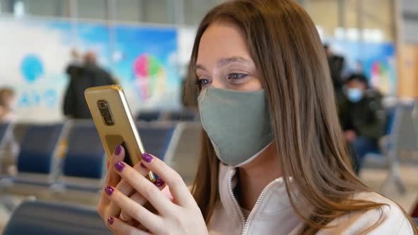 Woman in Dark Green Medical Mask in Airport