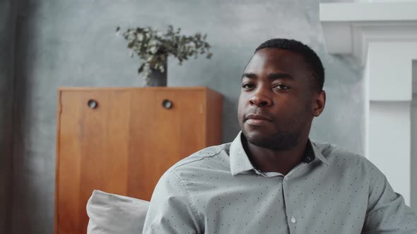 Positive Afro-American Man Looking at Camera and Smiling alt