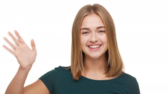 Headshot of Friendly Female Adult with Beautiful Auburn Hair Smiling on Camera Welcoming Saying alt