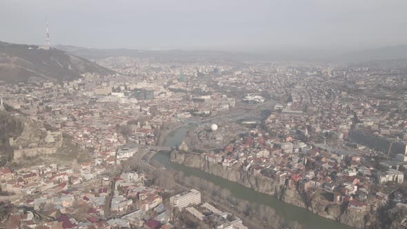 Aerial view of Metekhi church in old Tbilisi located on cliff near river Kura. Georgia 2021 winter alt