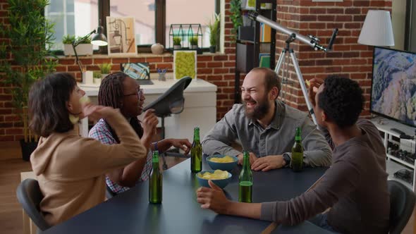 Multiethnic Group of People Enjoying Food and Drinks at Home alt