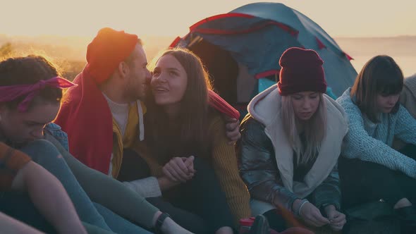 Positive Hikers Spend Time at Camping with Tent and Bonfire alt