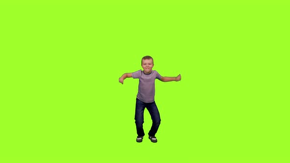 Little Boy Having Fun on Green Background
