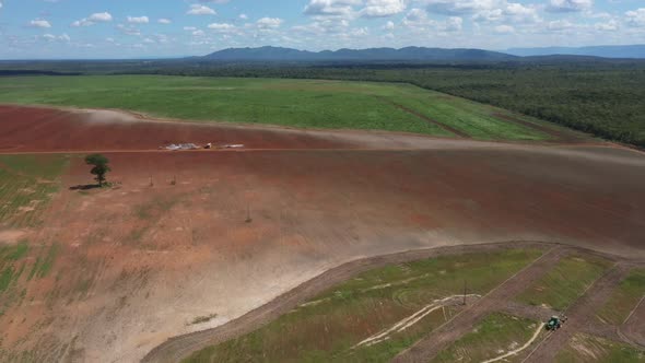 Land cleared by deforestation of the Brazilian Savannah to plow and plant soybeans - aerial pull bac alt