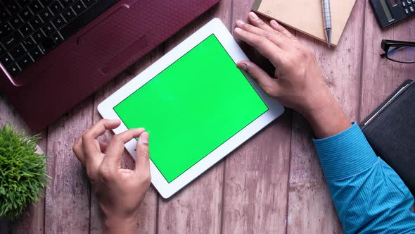 Top View of Businessman Using Digital Tablet with Green Screen  alt