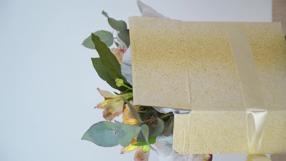 beautiful composition of delicate pink, white flowers rotation on the turntable. alt