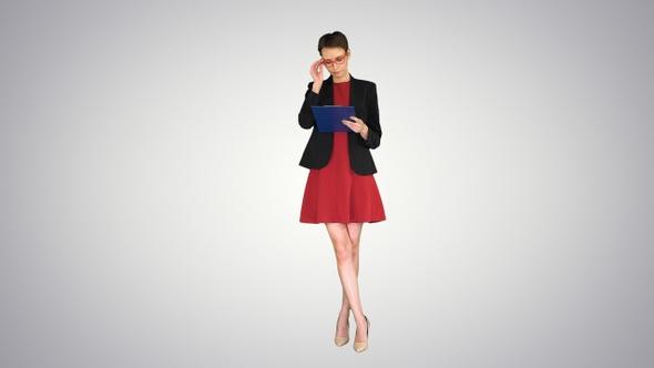 Young beautiful woman reading documents on gradient background. alt