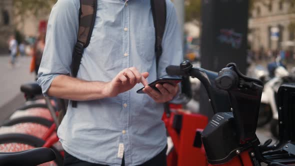 Woman Take Electric Kick Scooter or Bike Bicycle in Sharing Parking Lot Tourist Phone Application alt