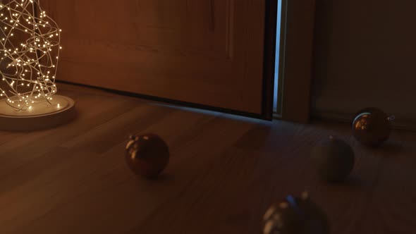 Christmas Balls Laying On Laminate Floor And Door Covered With Snow