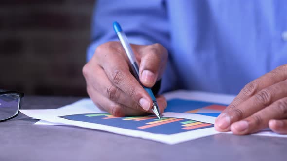 Businessman Analyzing Financial Data Close Up  alt