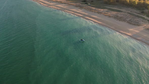 Boats in turquoise green sea alt