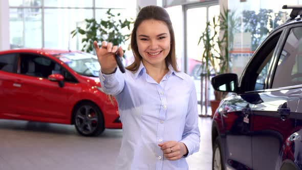 Woman Buys New Car at the Dealership
