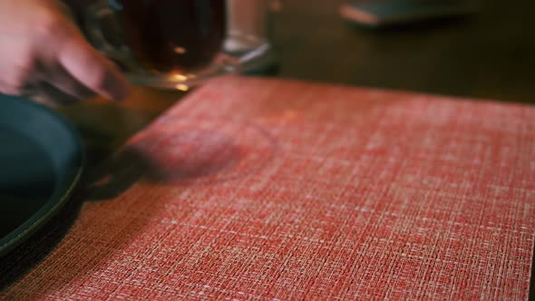 Little Girl is Served Dessert with Fresh Strawberries and Tea on a Tray alt