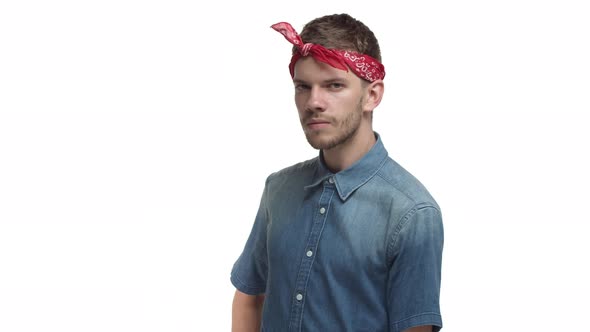 Sassy Hipster Guy with Beard Wearing Red Bandana Trying to Seduce Someone Looking Flirty and