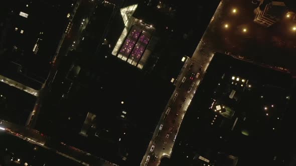 AERIAL: Slow Overhead Shot of City at Night with Lights and Traffic, Cologne, Germany  alt