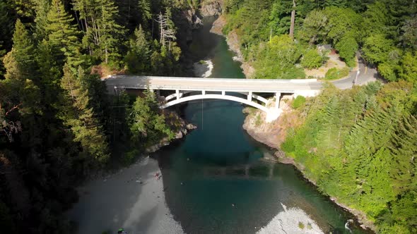 4K Car Crossing Bridge over Smith River in Redwood Forest near Humboldt County