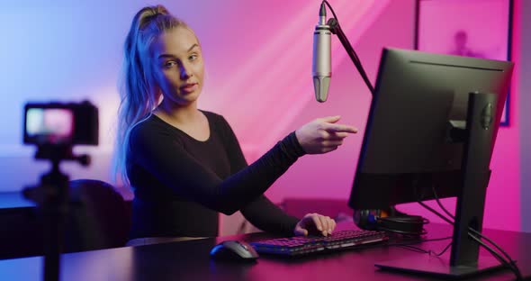 Focused Professional E-sport Gamer Girl Streaming Online Video Game on PC