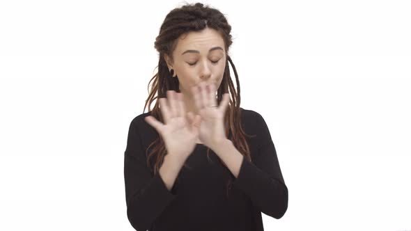 Pretty Hipster Girl with Dreadlocks and Ear Tunnels Wearing Black Casual Blouse Shaking Hands to alt