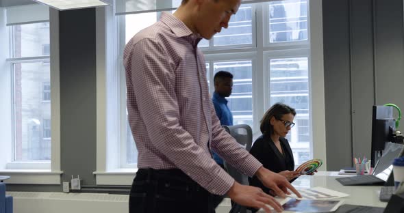 Business professionals working in a modern office alt