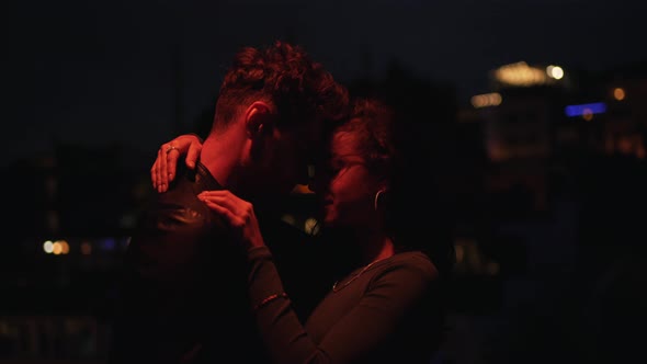 Couple Hugging in the Evening City