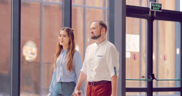 Man and a Girl Enter the Mall alt