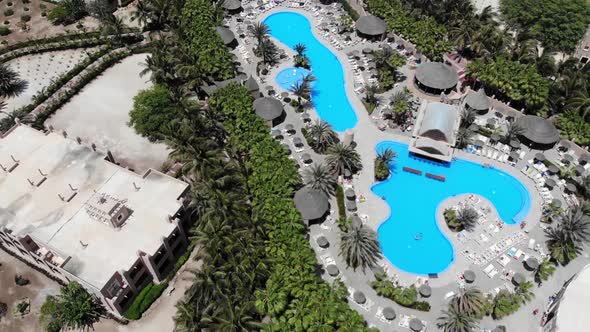 Aerial footage of the Hotel in Cabo Verde Cape Verde showing the swimming pools and building alt