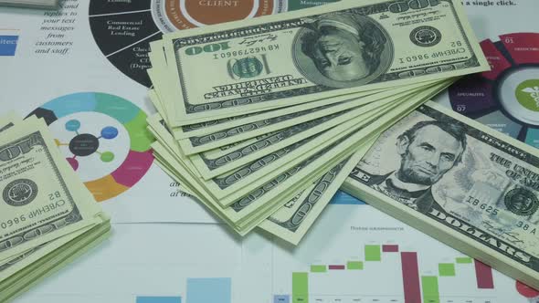 Business Planning Diagrams And Dollars On The Table In The Office Of The Company alt