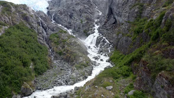 Scenery Of Waterfall Cascades Through Steep Rocky Slope Mountain At National Forest Park In Alaska, alt
