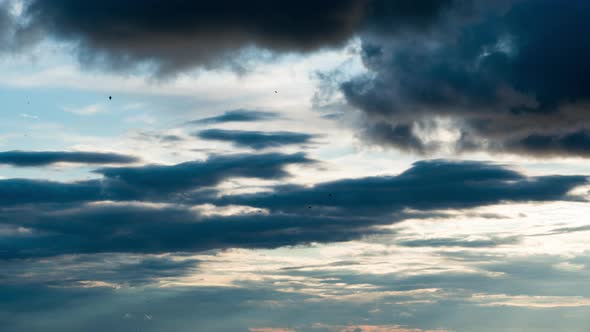 White Fluffy Clouds Slowly Float Through the Blue Daytime Sky Timelapse alt