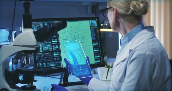 Scientist Using Holographic Display Screen alt