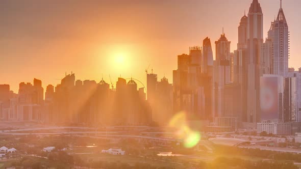 Dubai Marina Skyscrapers and Golf Course Sunset Timelapse Dubai United Arab Emirates alt